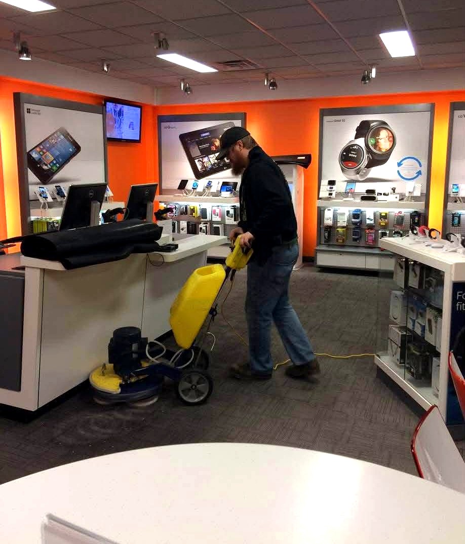 True Clean technician using our low-moisture encapsulation carpet-cleaning machine on commercial carpet